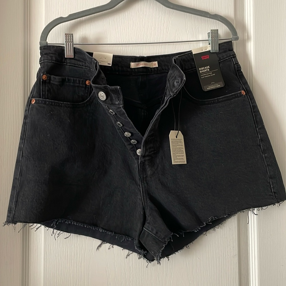 Levi’s black button fly ribcage shorts. 33